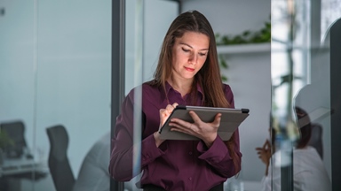 Woman-using-tablet-in-office