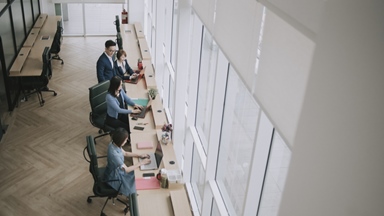 Asian-colleagues-open-plan-office