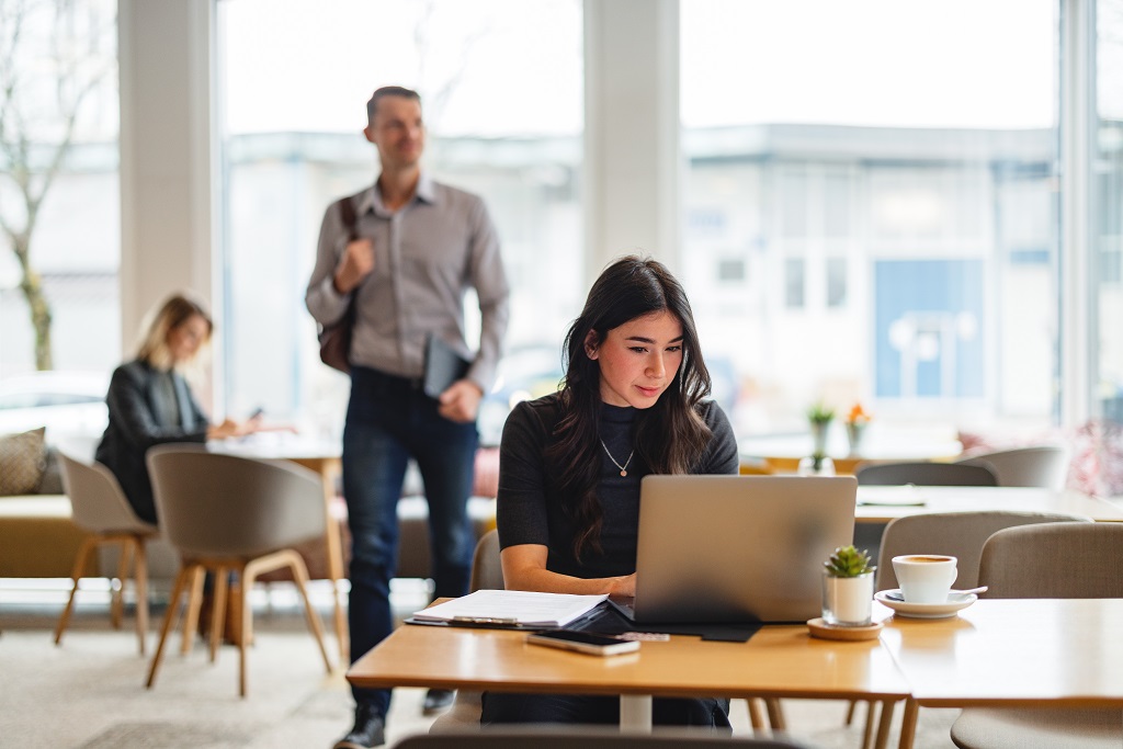 Woman-on-laptop-in-open-workspace