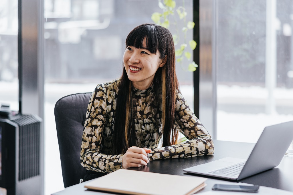 Asian-woman-sitting-at-laptop