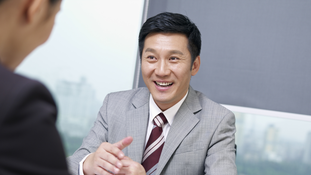 Male-in-suit-in-meeting