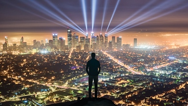 Person standing cliff looking city