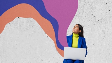 Women sitting laptop looking colourful cloud