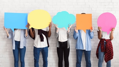 Teens holding speech bubbles