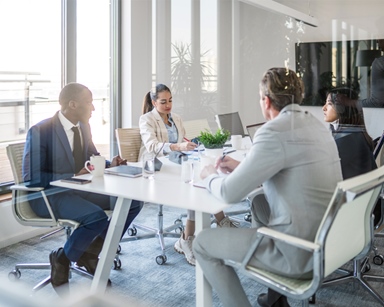 People sitting at table having a work meeting