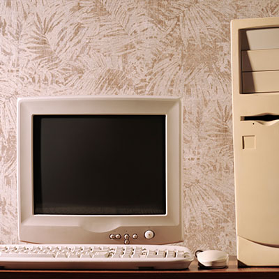 Computer with keyboard and mouse on wooden table
