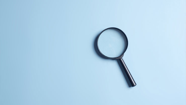 Magnifying glass blue background