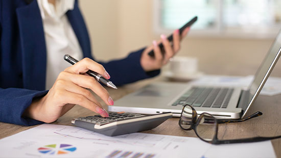 Person working desk laptop phone