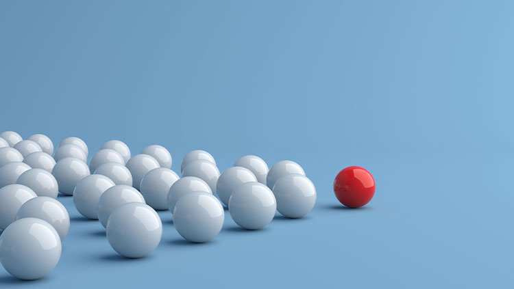 Leadership concept red ball leading white balls