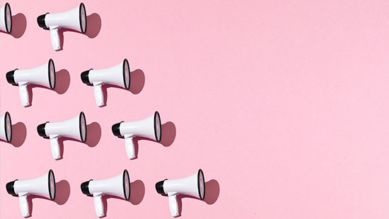 White microphones pink background