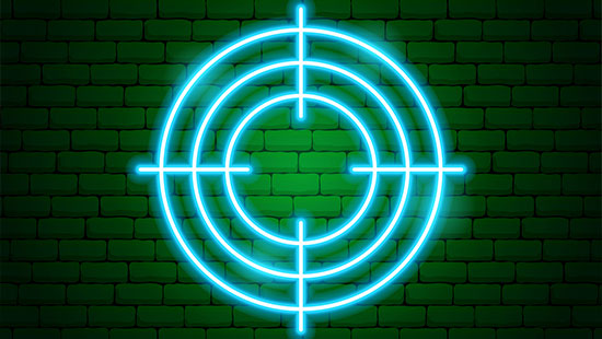 Target on green brick wall