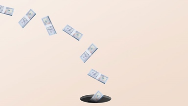 Money flying down drain