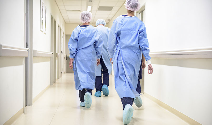 Hospital staff walking hallway