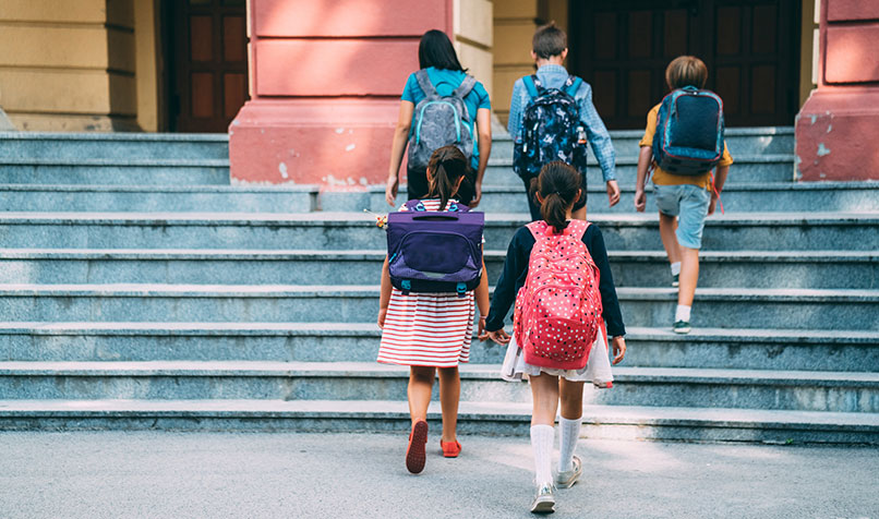 children walking into school