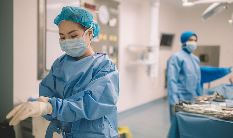 Staff working in hospital in scrubs