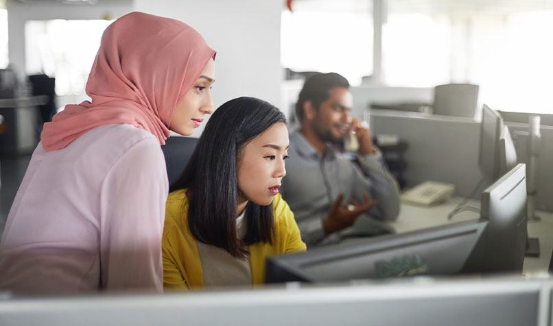 Women in office looking at computer