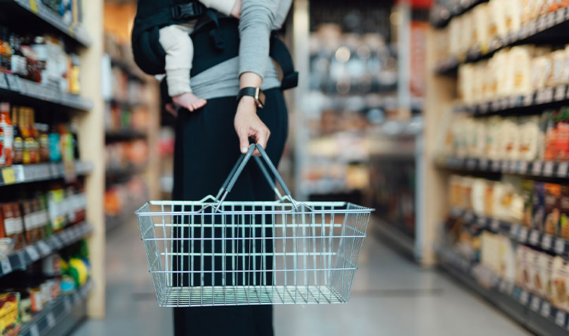 Grocery store a women and baby with an empty basket