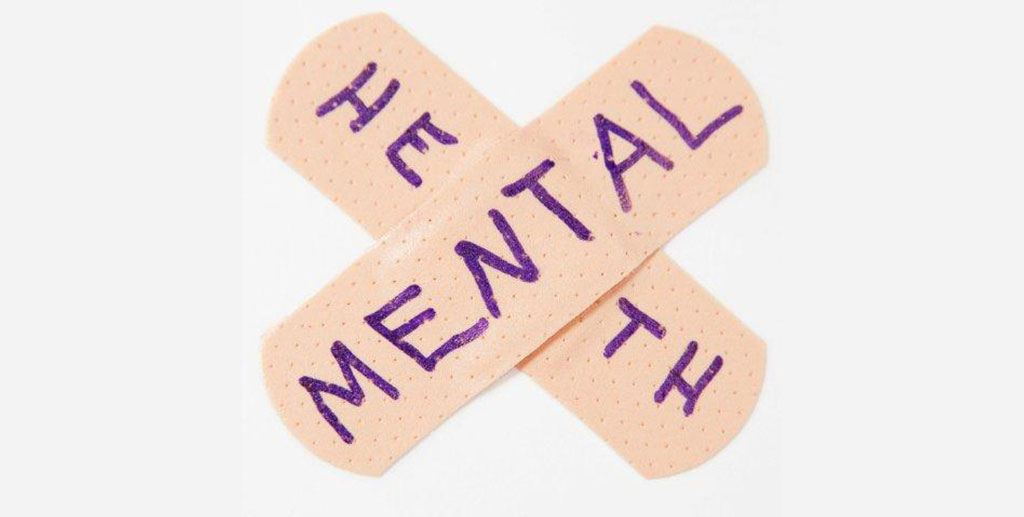Mental health written on band aids