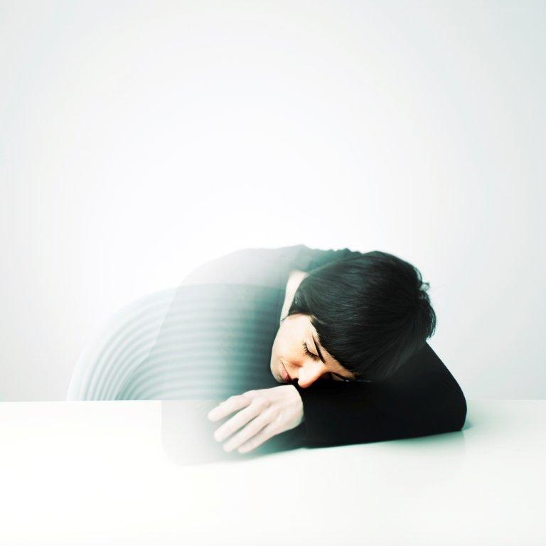 Person sleeping on desk