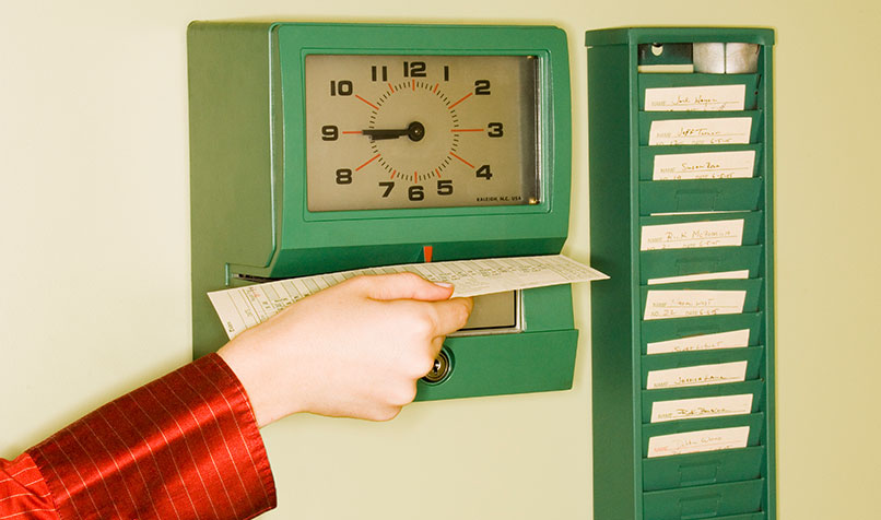 person clocking timesheet