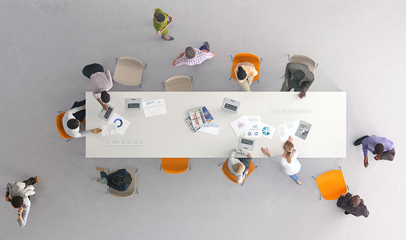 overhead looking down at work tale with employees working
