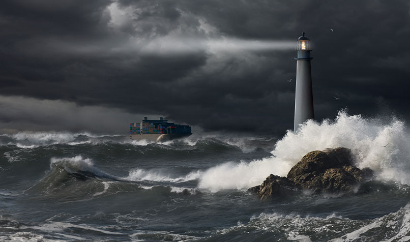 Lighthouse container ship rough seas