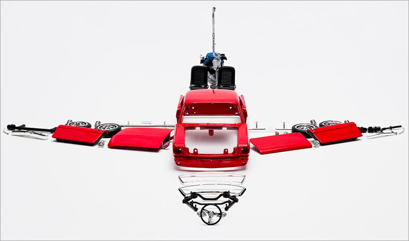 Model car pulled apart plane shape