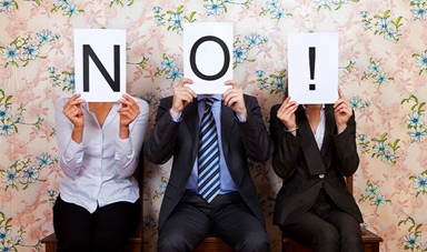 Three people holding no sign