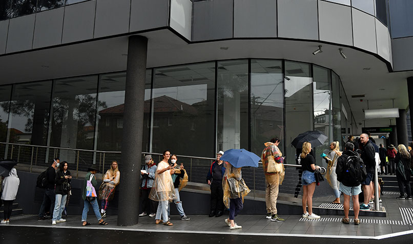 People queuing outside a Centrelink office