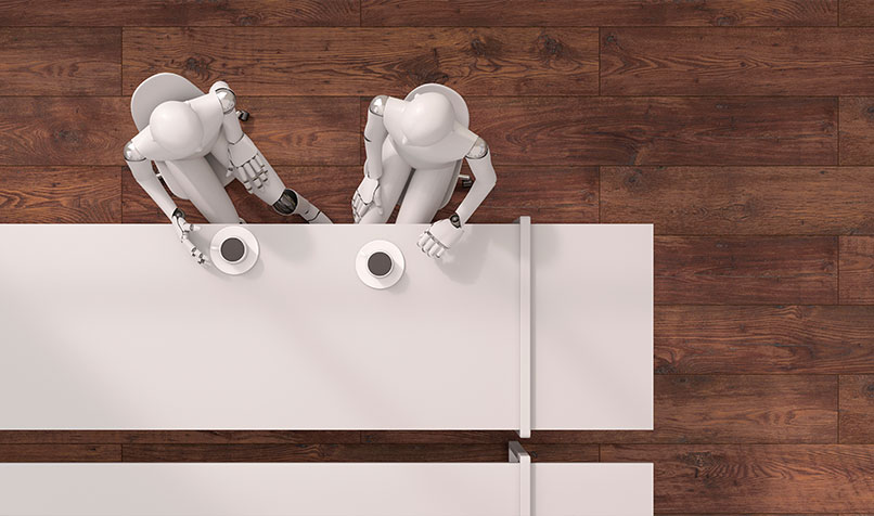 Two robots sitting coffee