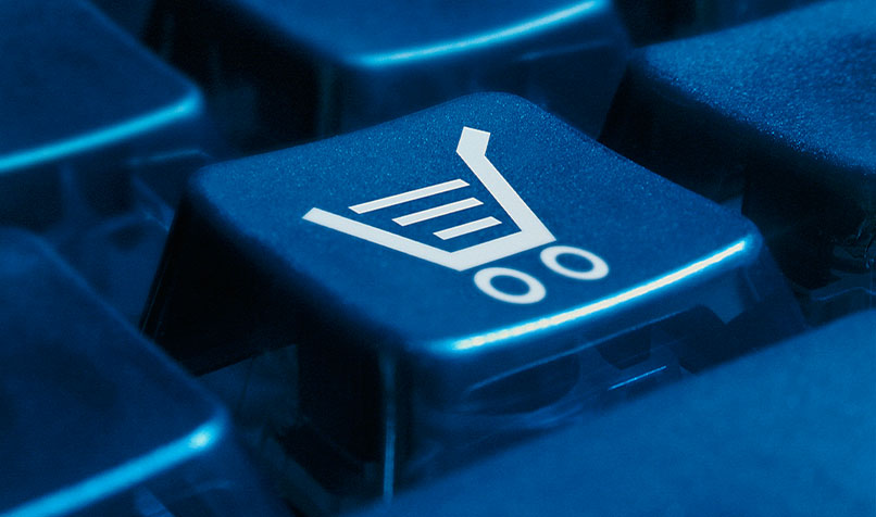 Computer keyboard with key with shopping trolley