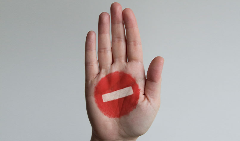 Hand with stop icon on palm