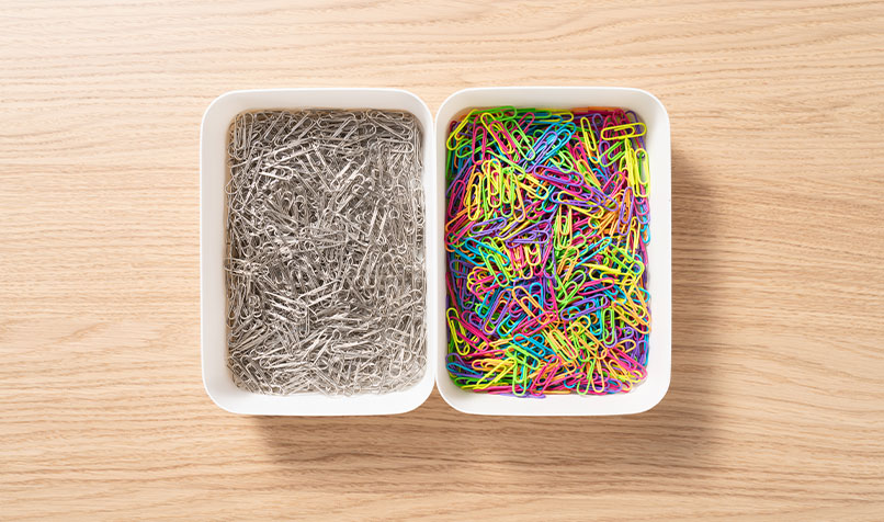 Paper clips sorted on table