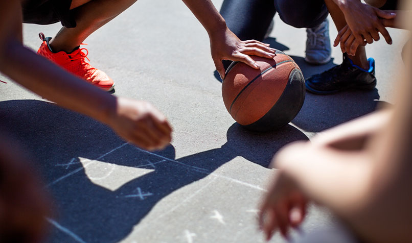 People crouching basketball