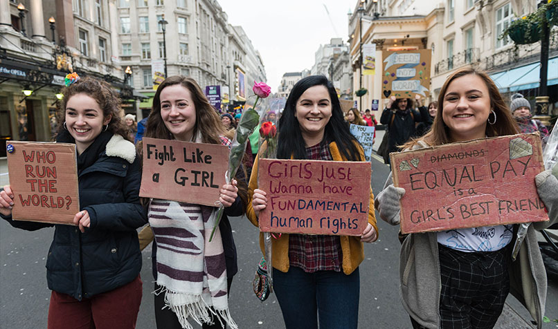 Women participate in a protest against the gender pay gap