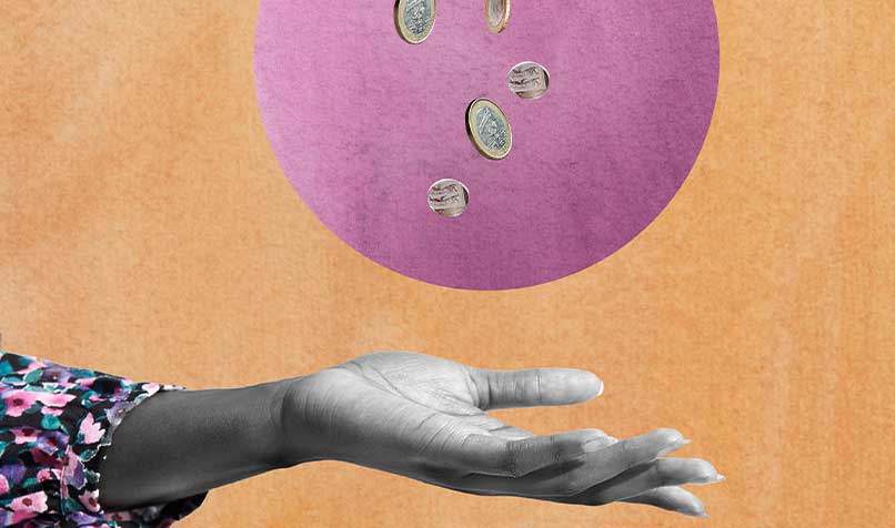 Hand outstretched coins falling