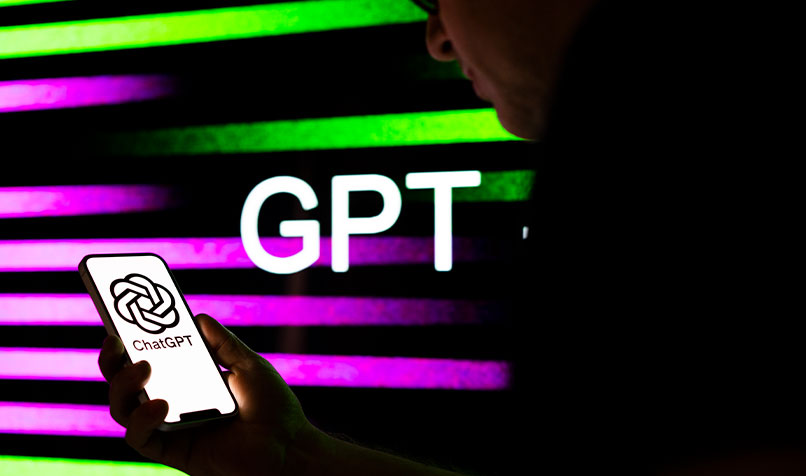 Person holding phone ChatGPT