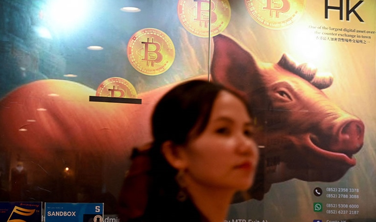 Women passing crypto trading office