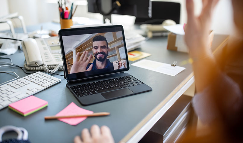 Online meeting people waving on laptop