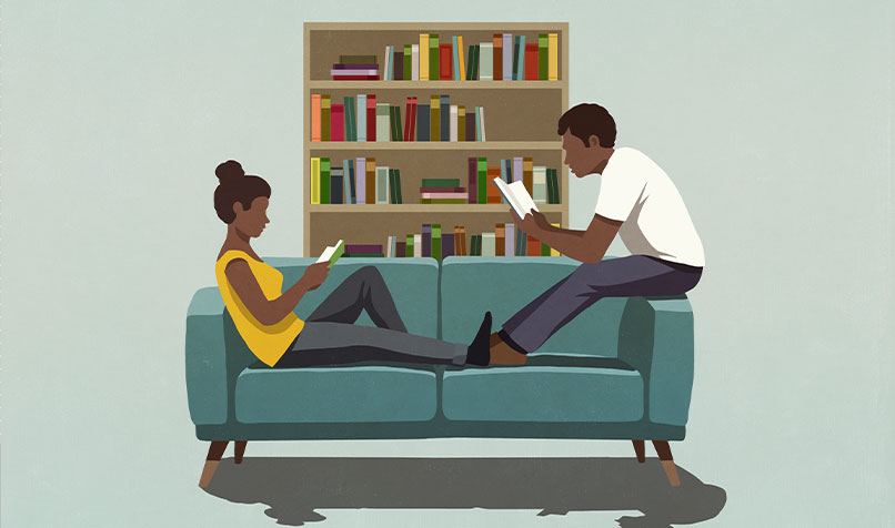 Couch two people sitting reading