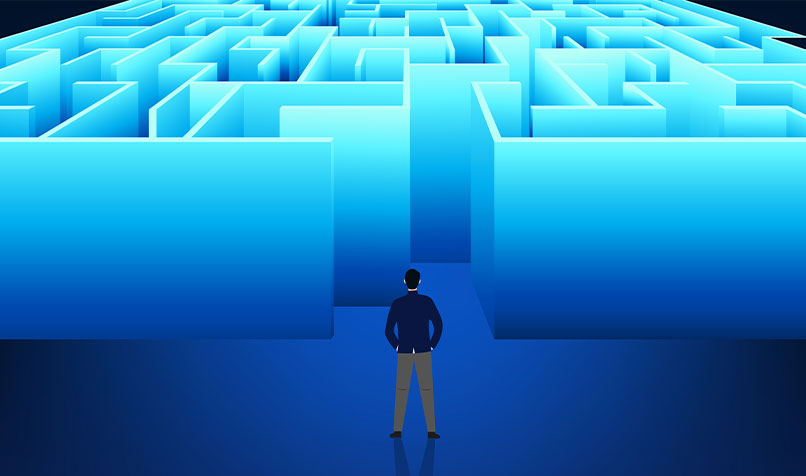 Person standing in front blue maze