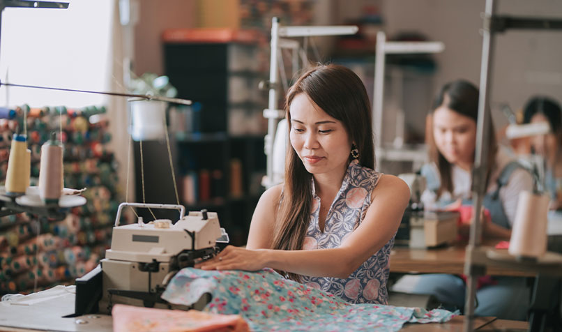 Person using sewing machine
