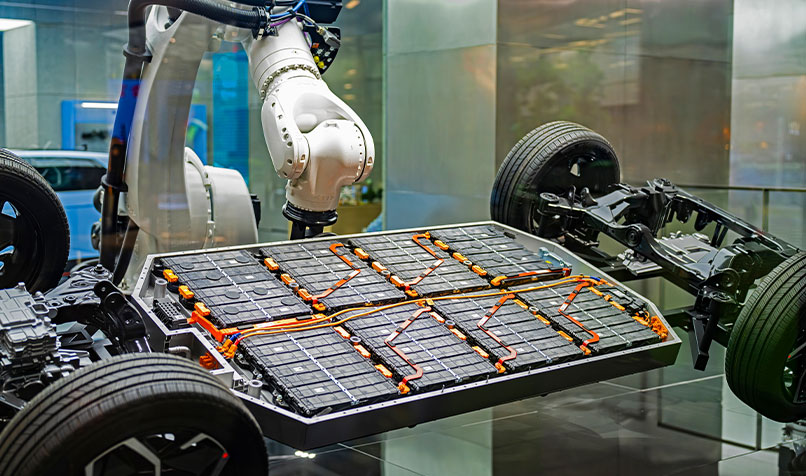 industrial robotic arm installing battery