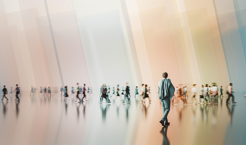Person walking blurred crowd in background