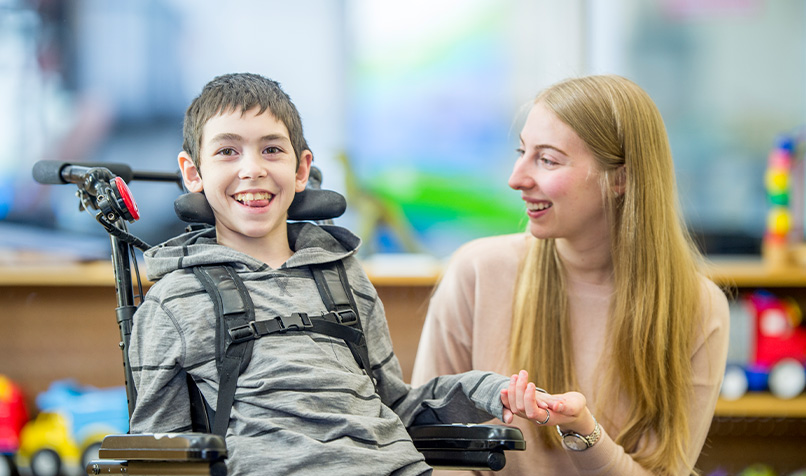 Child with disability and care worker