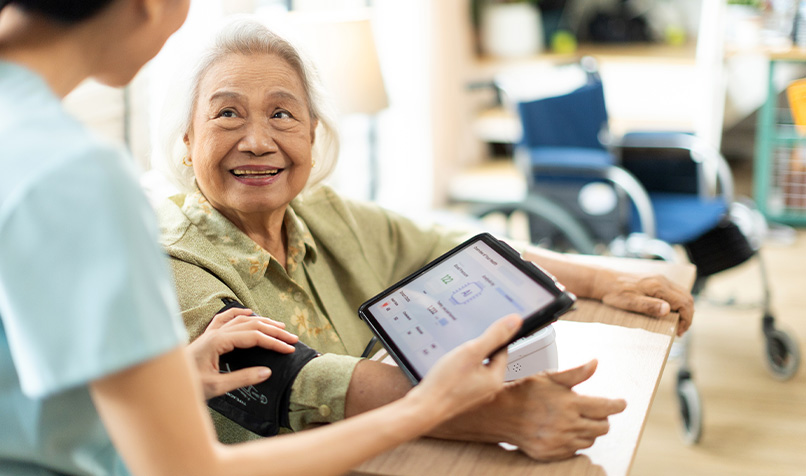 Older women getting blood pressure taken