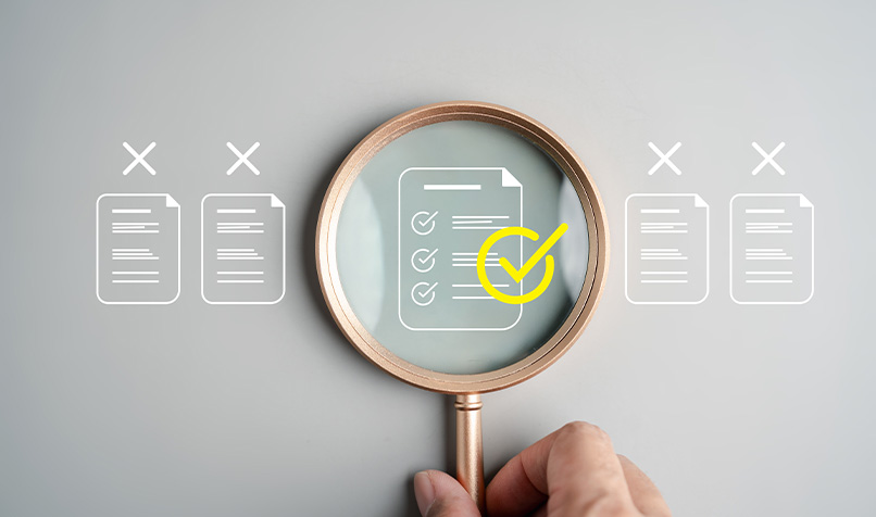 Magnifying glass looking at documents