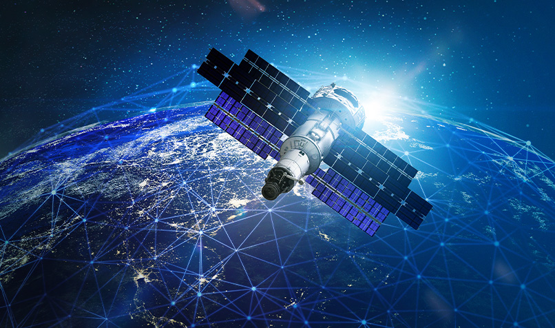 Satellite in low Earth orbit above the planet, with city lights visible across the surface and interconnected network lines spanning the globe.