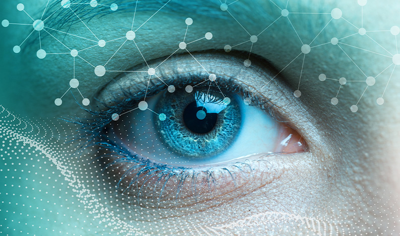 Extreme close-up of a blue eye overlaid with a network of connected dots, lines and digital data patterns. The image combines detailed facial features with abstract technology graphics, including interconnected nodes and flowing dotted waveforms layered across the frame. Cool shades of blue, turquoise and white dominate the composition, creating a futuristic visual that represents artificial intelligence, data analysis, digital connectivity or advanced technology.