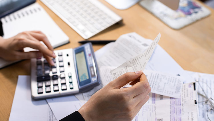 Person calculating bills